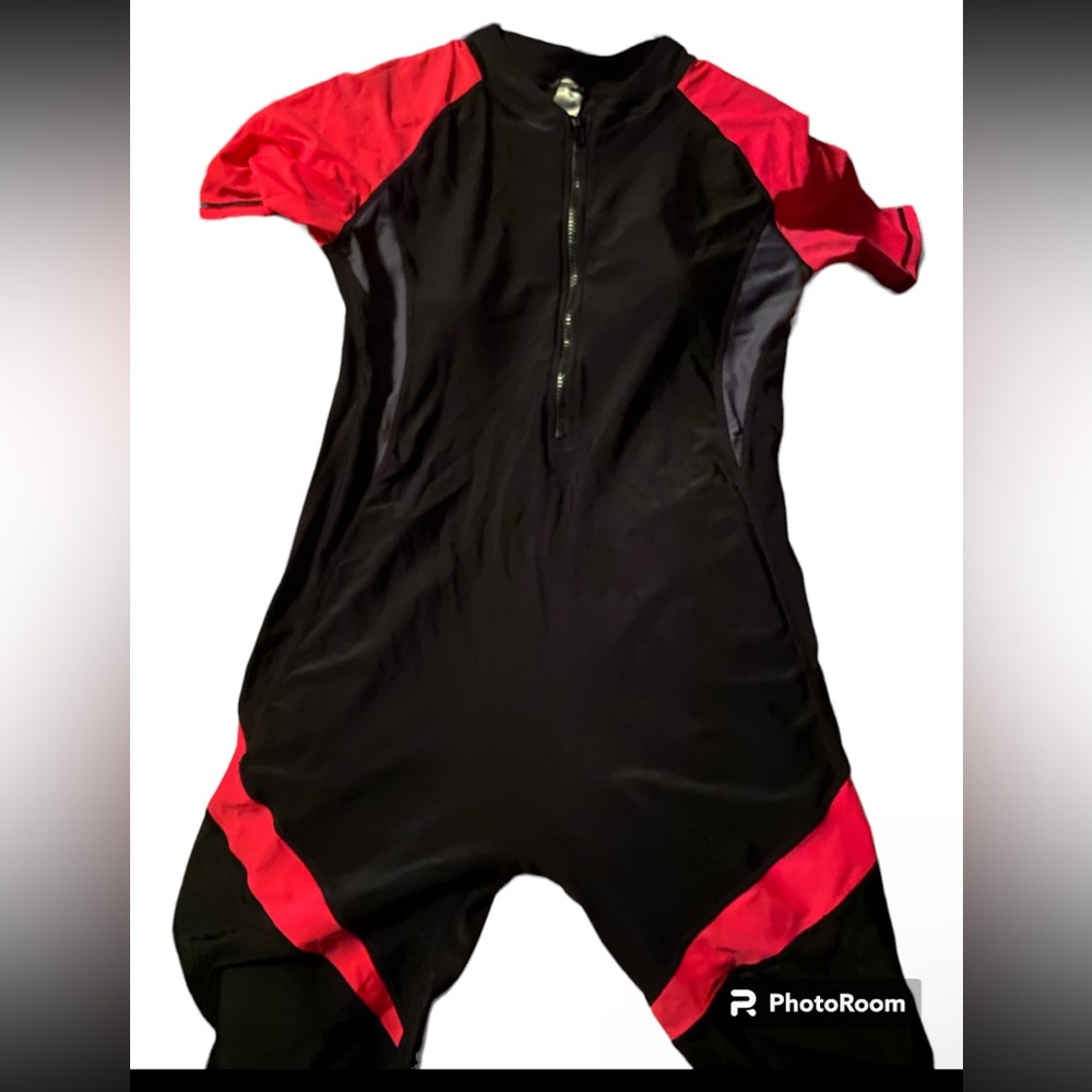 Pink, black, and gray whole piece swimsuit with a black zipper.